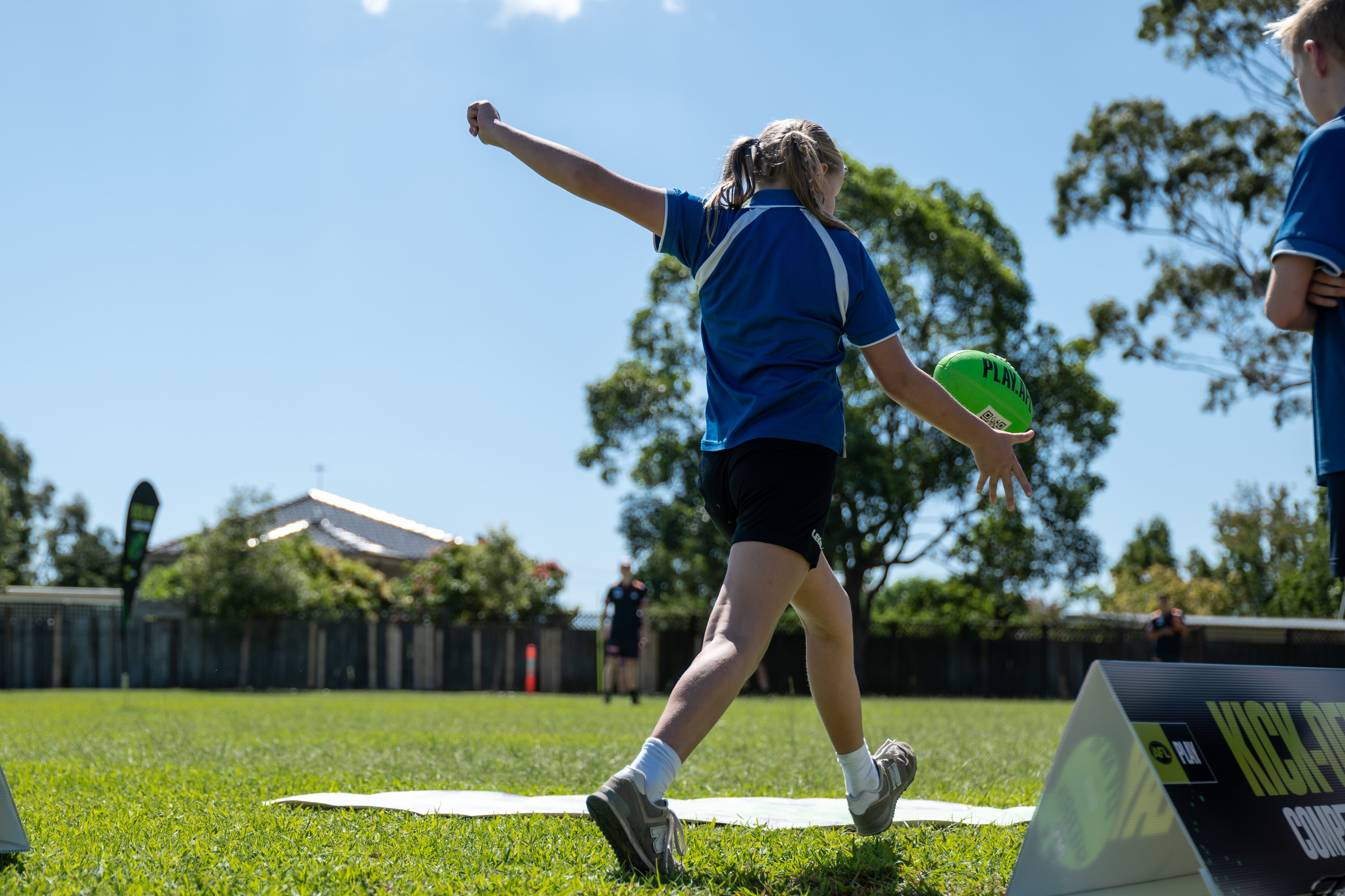 An Excelsior Public School students lines up for the longest kick.