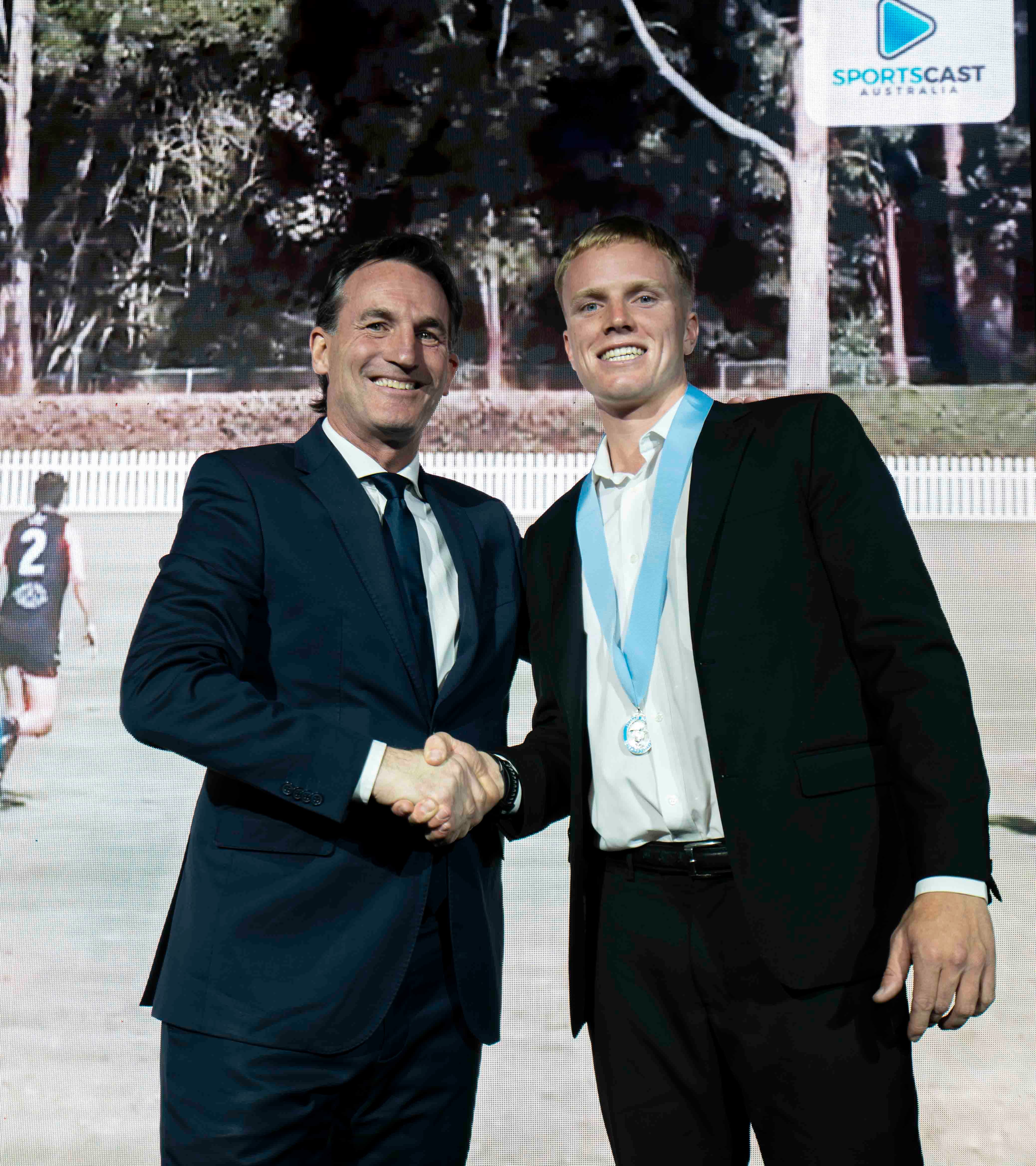 2026 Phelan Medallist, Luke Parkinson (South West Sydney Blues) and Andrew Dillon (AFL CEO)