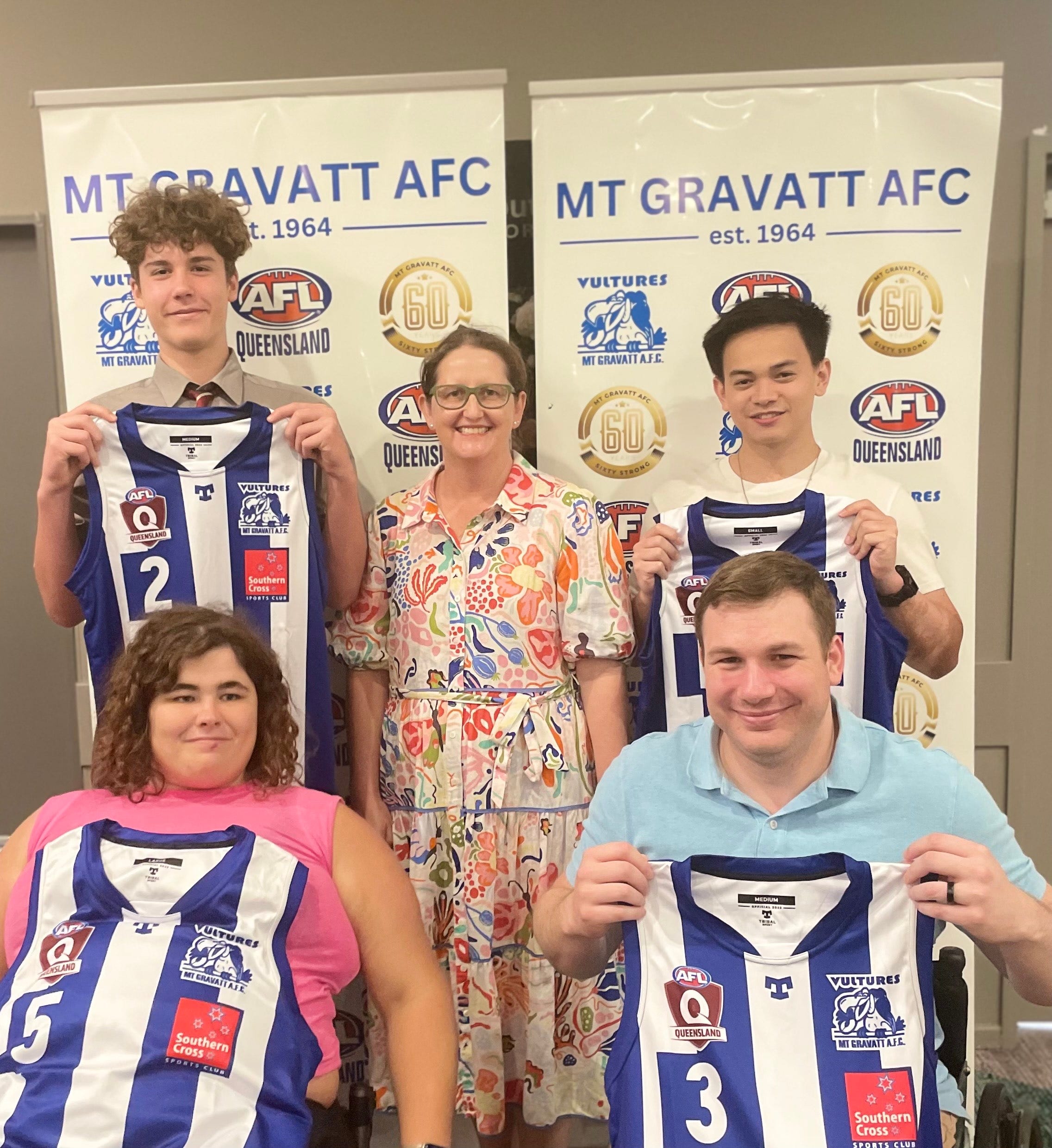 Mt Gravatt team members receiving their jumpers.