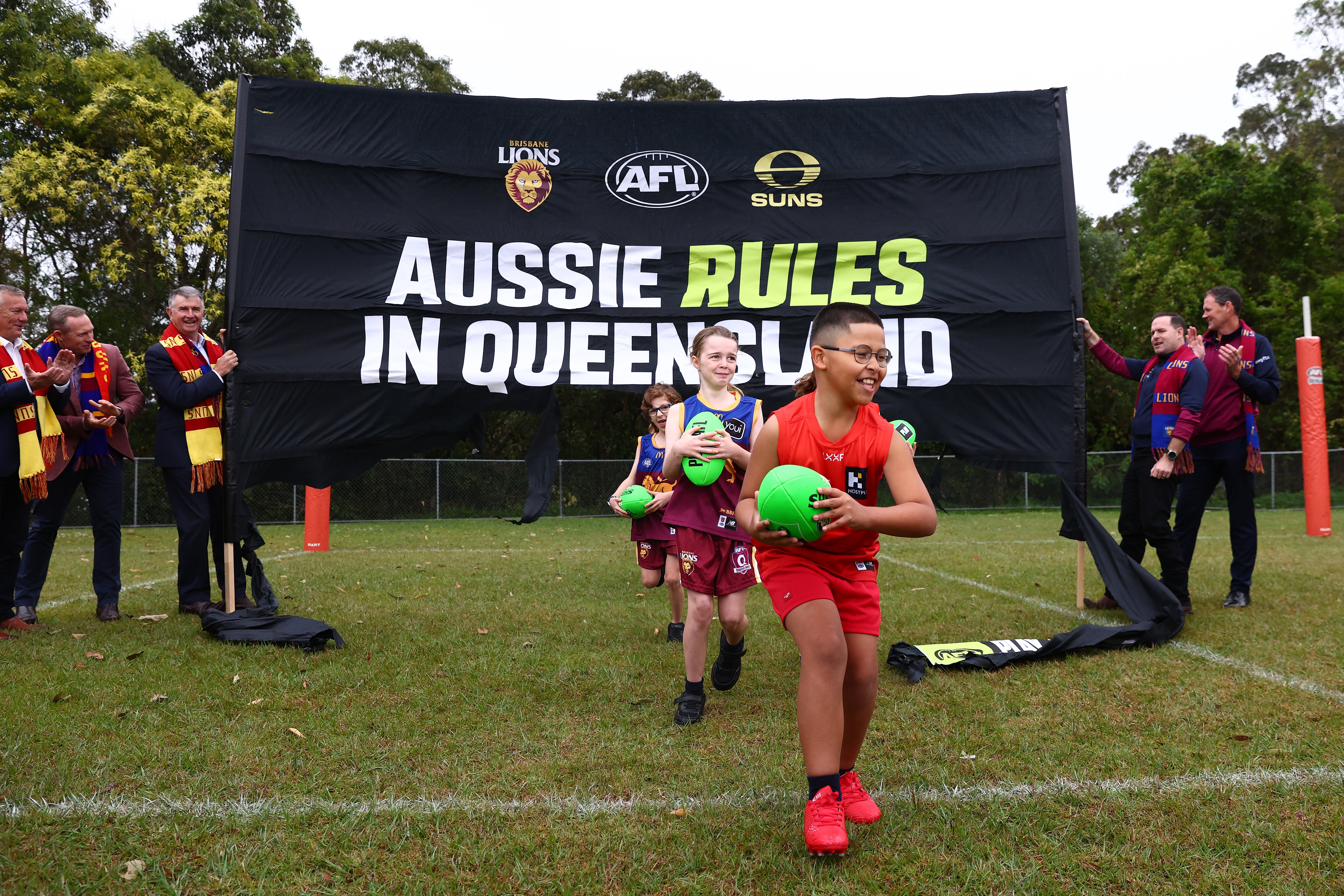 Kimberley Park State School students running through banner