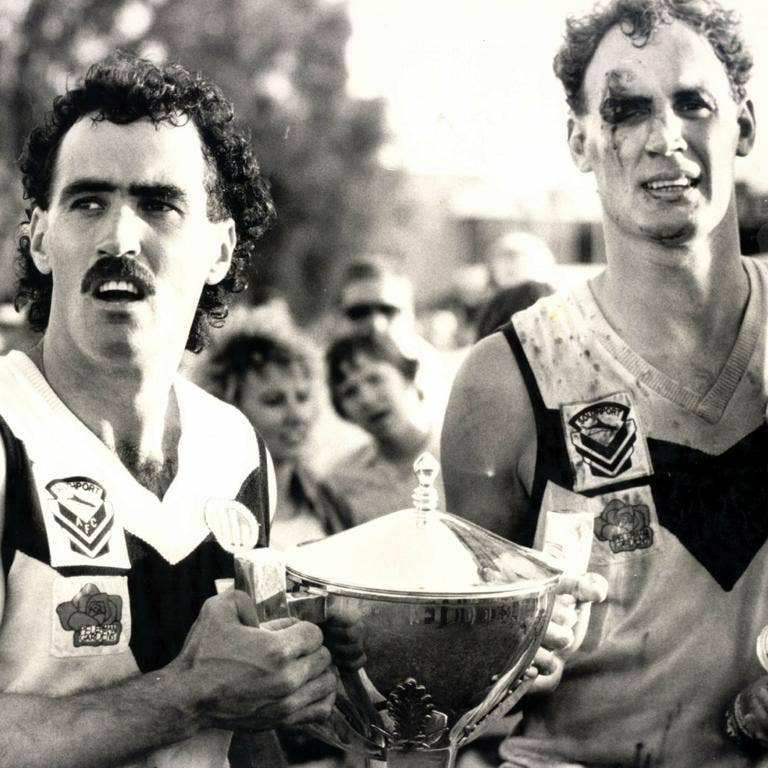 Gary Dempsey with Zane Taylor when he played at Southport in the QAFL Grand Final